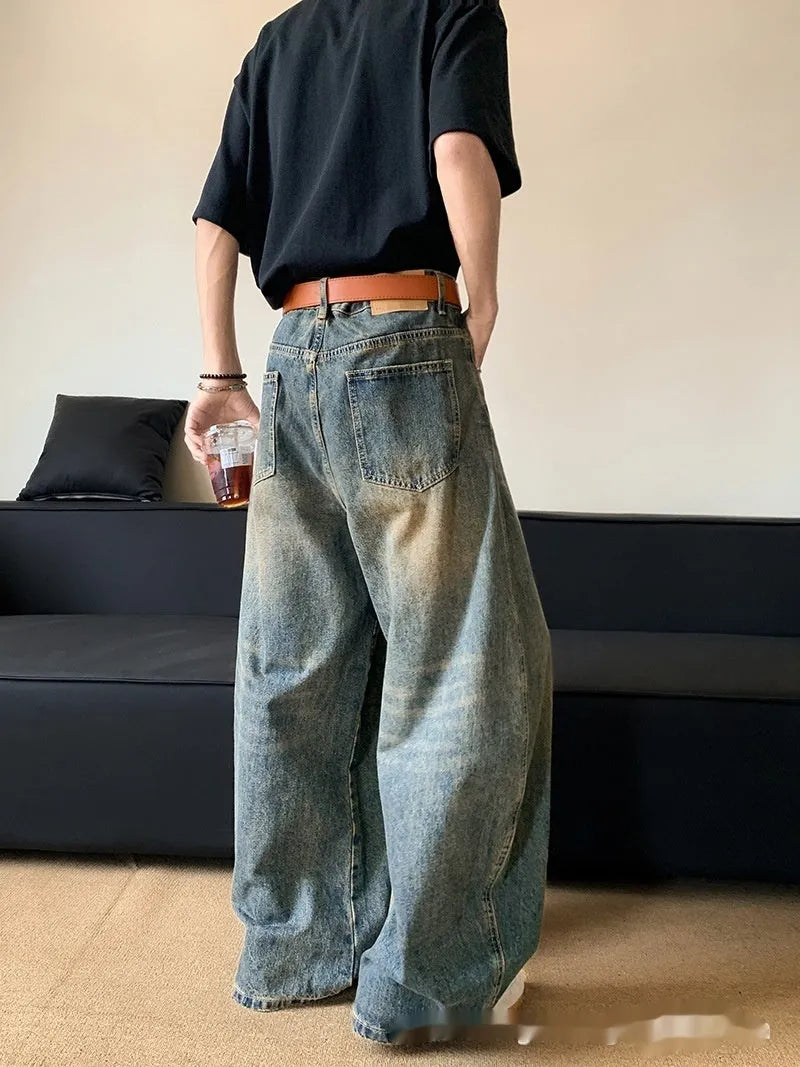 Men's retro blue distressed slim-fit wide-leg jeans on a model