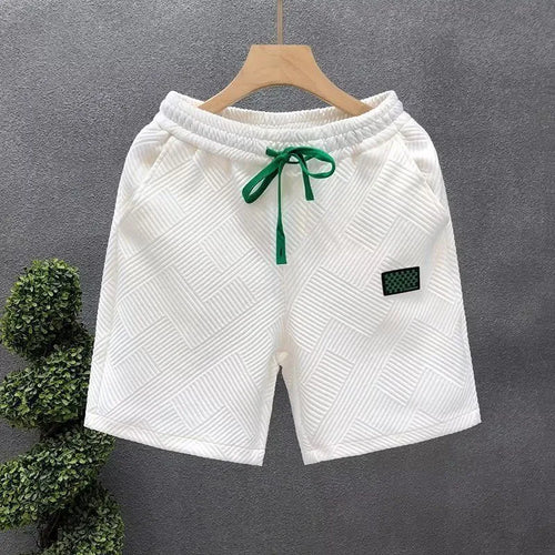 Casual solid colour sports shorts made from elastic polyester fabric.