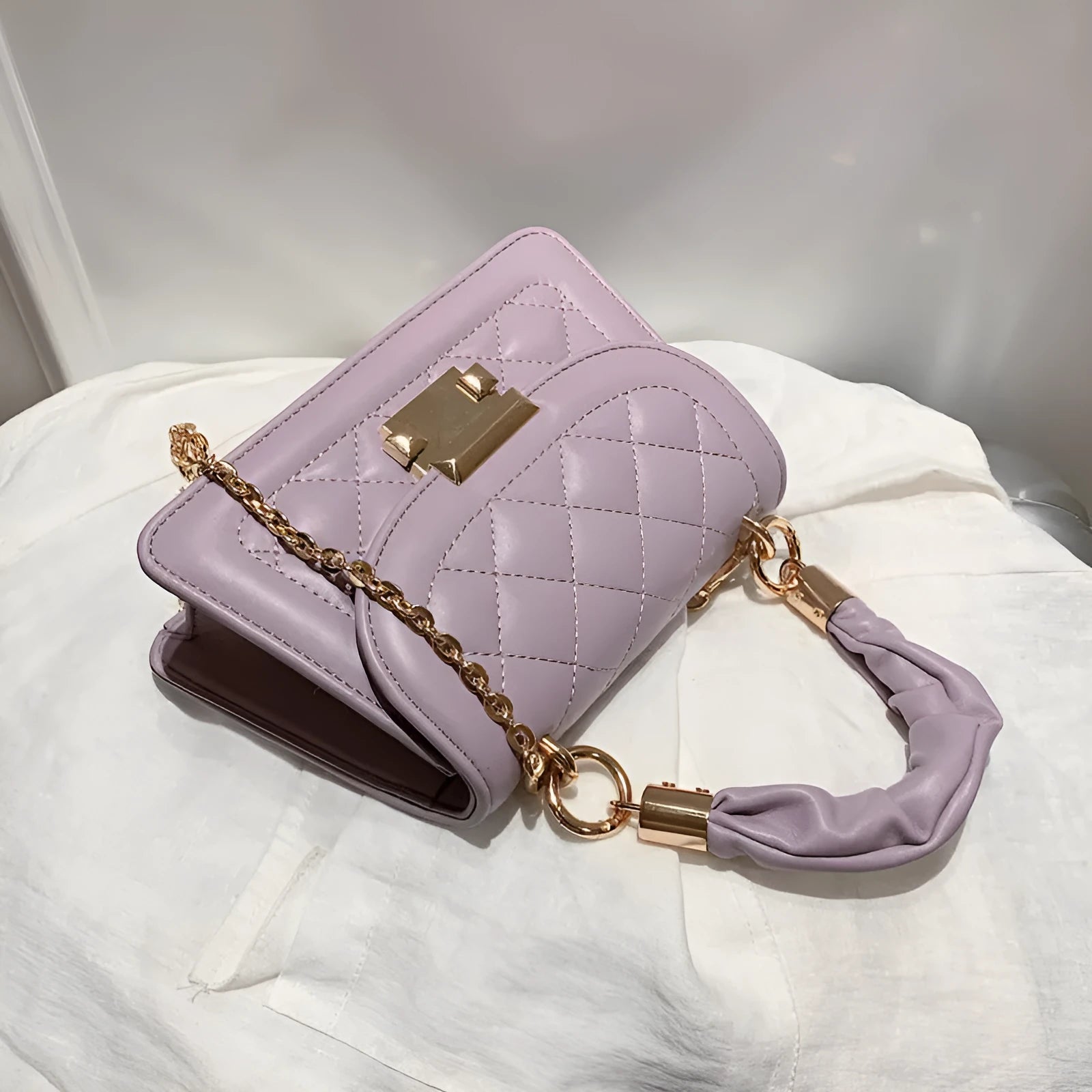 Korean-style rhombus shoulder bag in purple with crossbody strap and small square design
