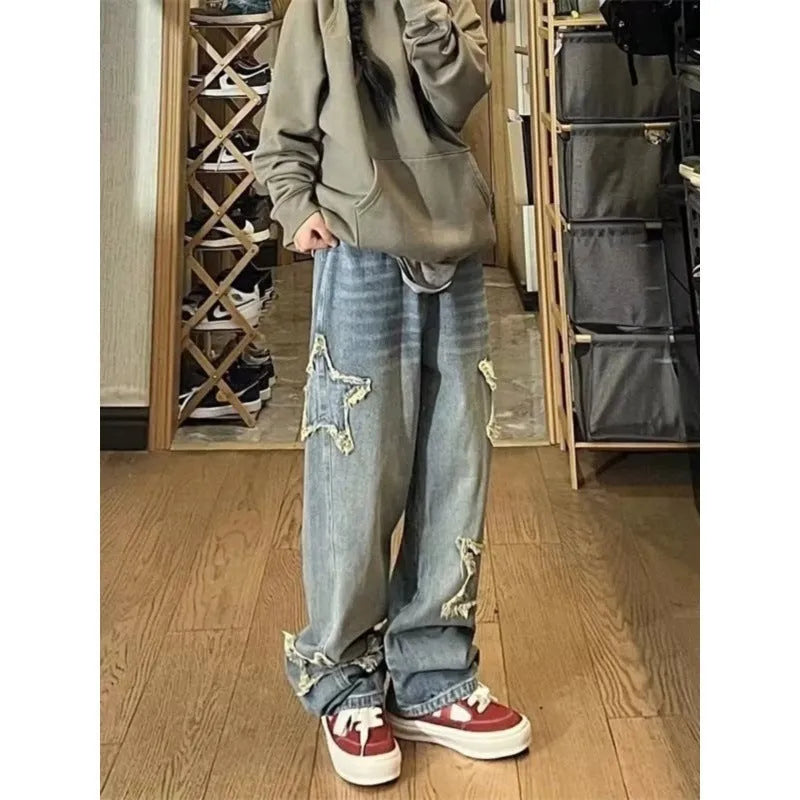 Blue high-waisted wide-leg women's jeans made from cotton denim on a model.