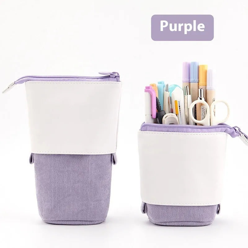 Corduroy drop-down telescopic stationery case in six colour options on a desk
