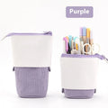 Corduroy drop-down telescopic stationery case in six colour options on a desk