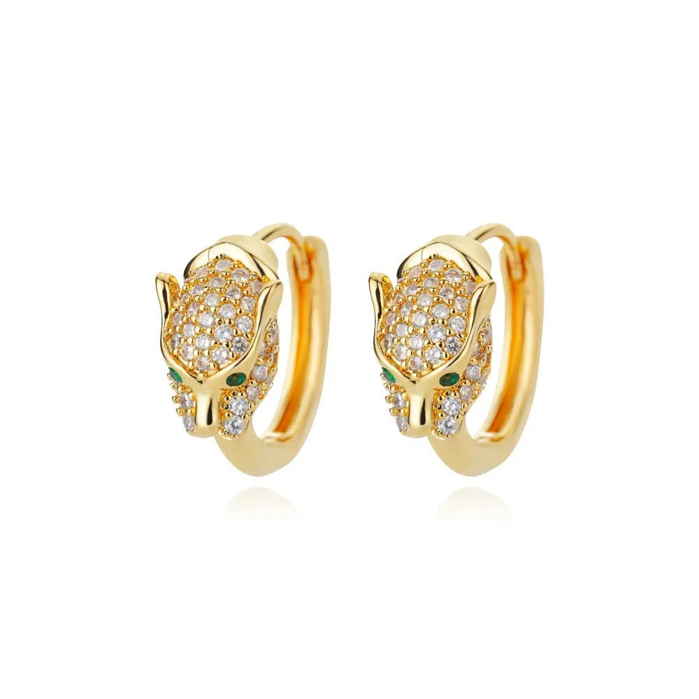 Geometric butterfly-shaped earrings with heart, bow, and star details in copper with a diamond-cut finish.