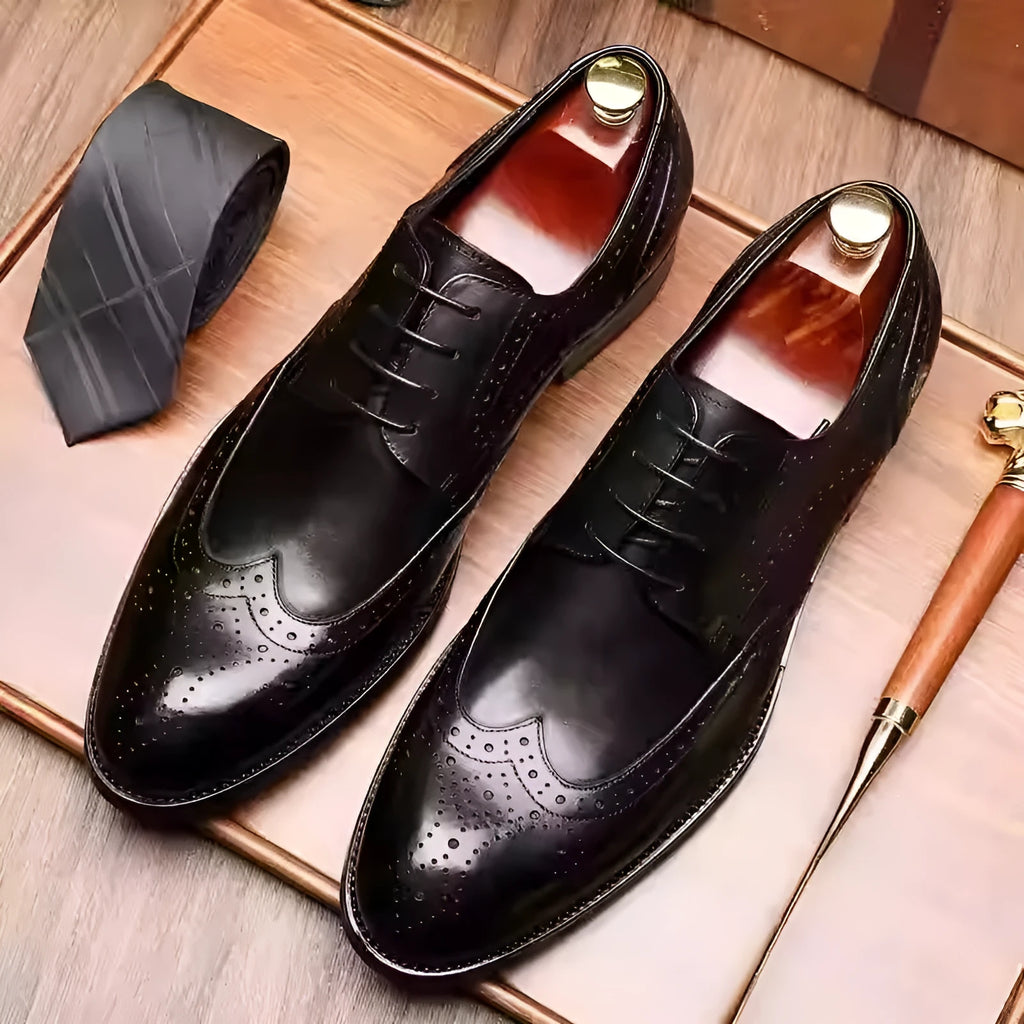 British-style men's formal pointed toe leather dress shoes with carved patterns in burgundy