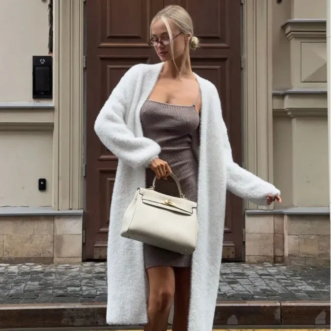 White thick knit polyester cardigan jacket with long sleeves and loose fit