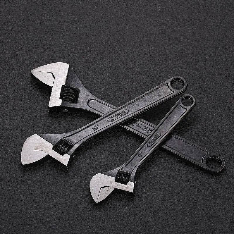 High-carbon steel open-end adjustable wrench with black finish on ergonomic handle.