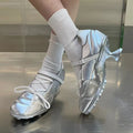 Women's silver lace-up bow sports shoes with mid heel and microfiber upper, college style casual trainers