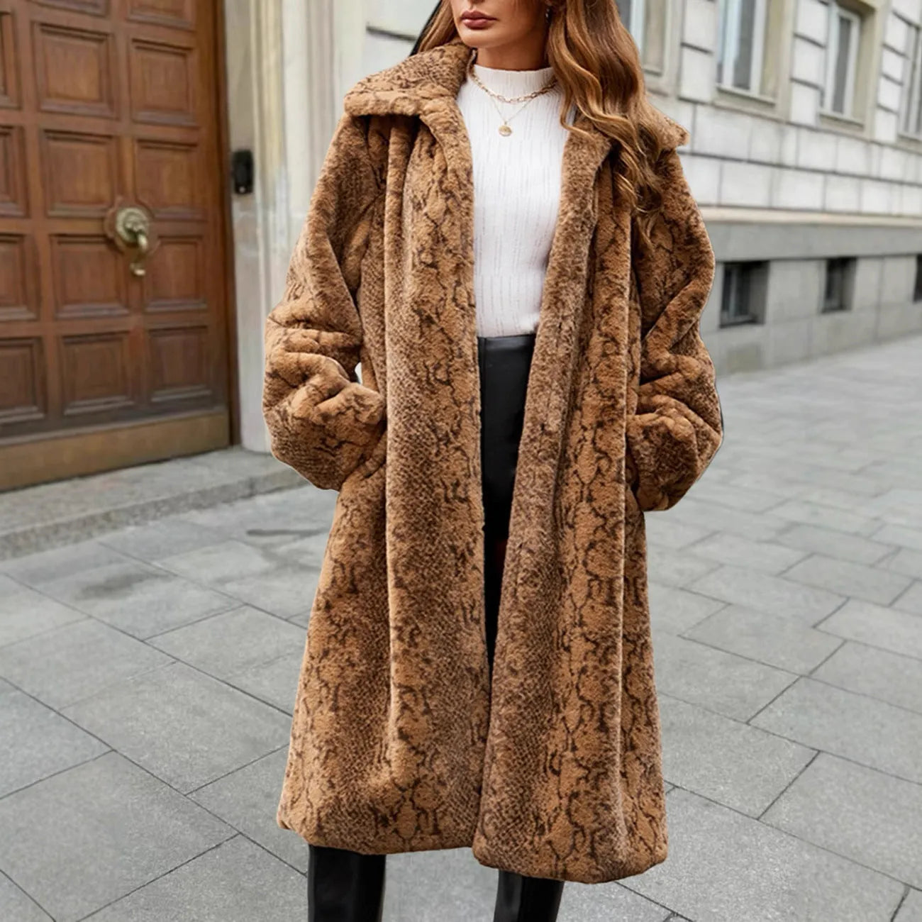 Women's long white leopard print faux fur coat with regular sleeves, shown as an over-the-knee length garment.
