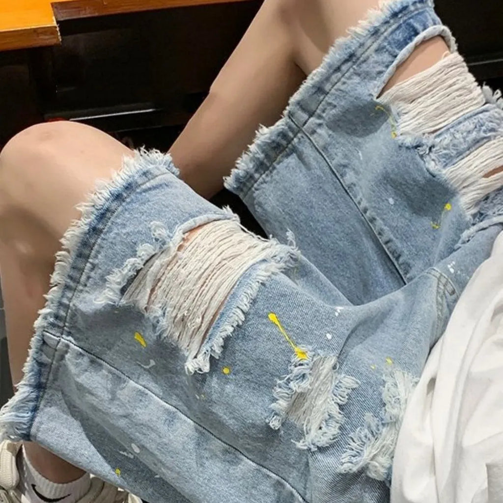 Men's loose fit light blue water washed denim shorts on a hanger.