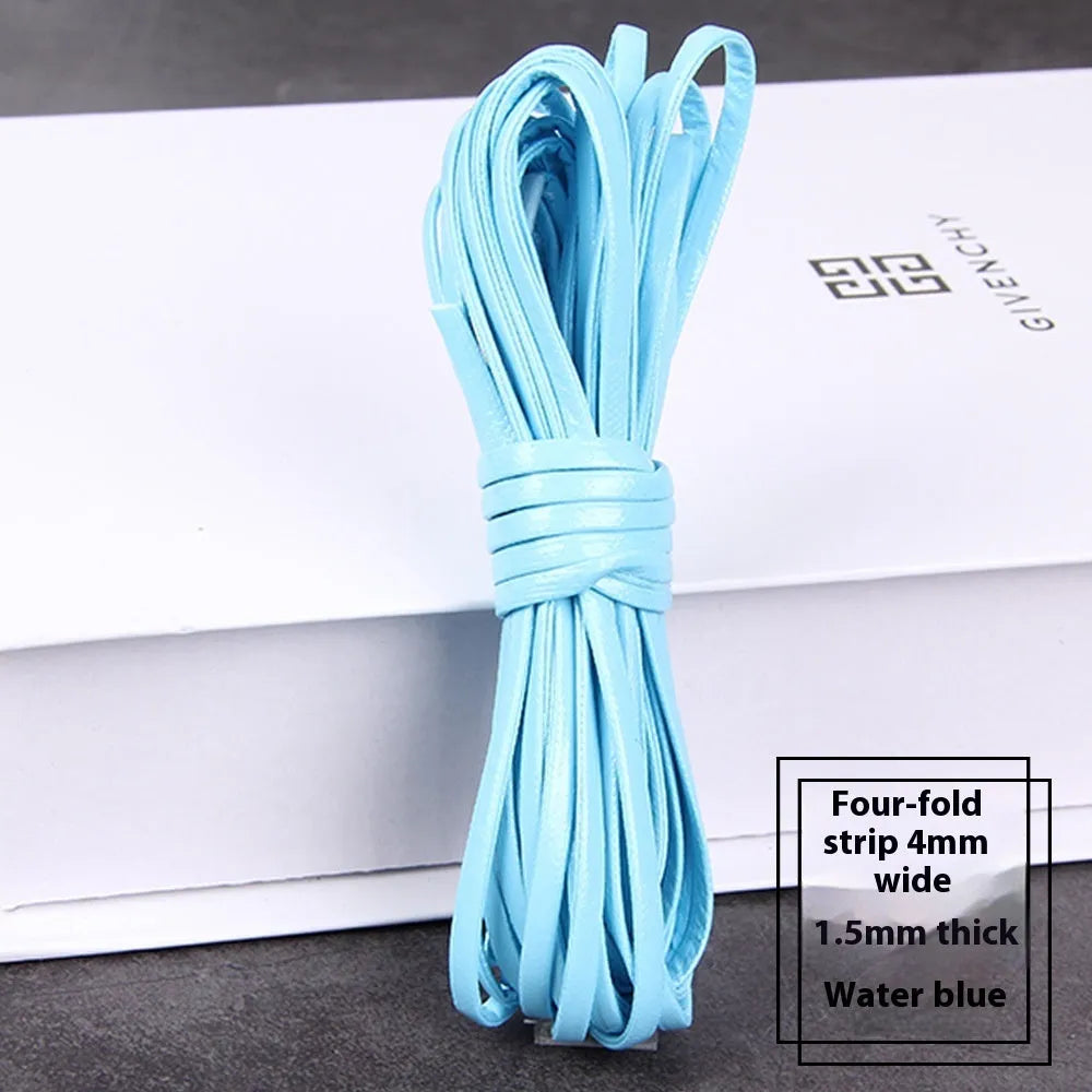 Rolls of soft PU leather weaving cord in various colours and widths for craft projects.