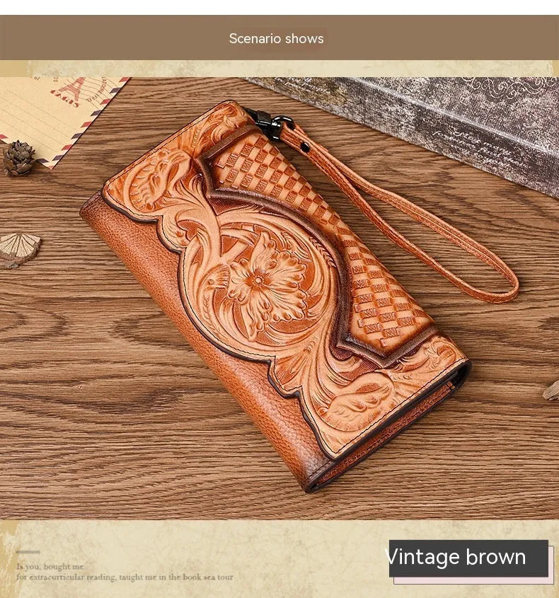 Brown genuine leather tri-fold wallet with embossed floral pattern, shown open to display compartments.