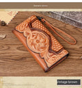Brown genuine leather tri-fold wallet with embossed floral pattern, shown open to display compartments.