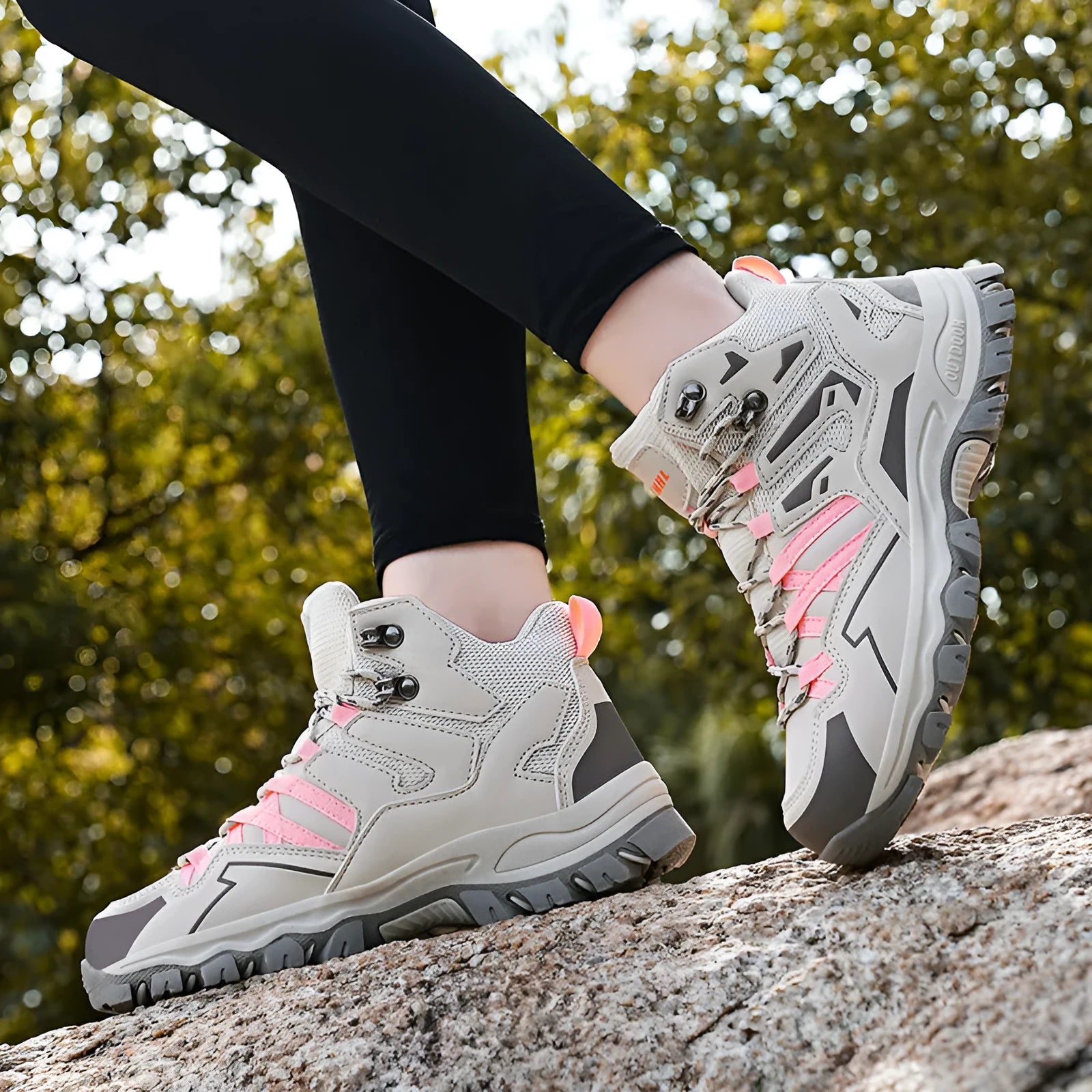 A pair of low-top hiking sneakers with a lace-up front, shown in a colour option like grey or purple.