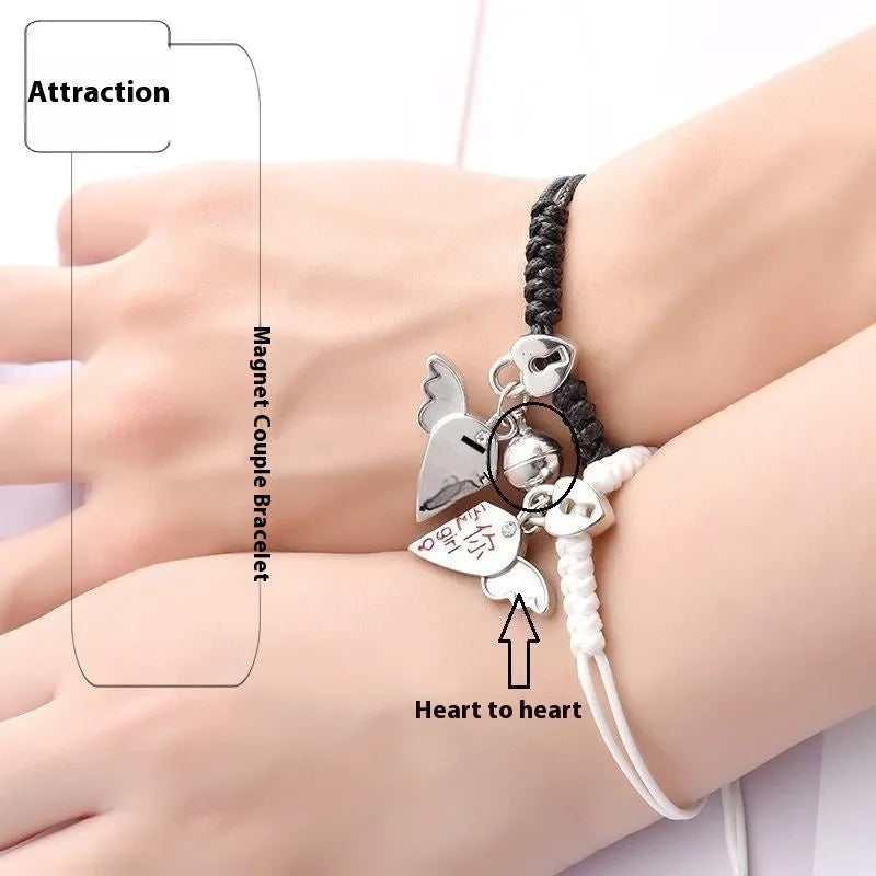 Pair of alloy suction bracelets with engraved symbol choices including crown, love lock, and clover.