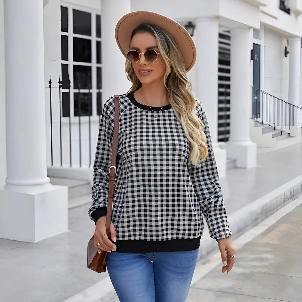 Black long sleeve pullover sweater with a Japanese sweet plaid striped pattern.