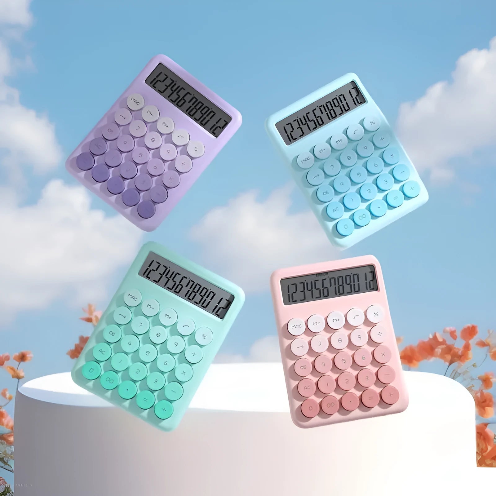 Dopamine gradient colour desk calculator in violet, pink, blue, and mint green on a desk.