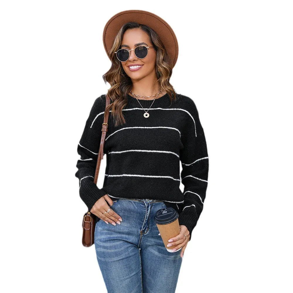 Women's striped pullover sweater in black and white colours with loose street fashion styling