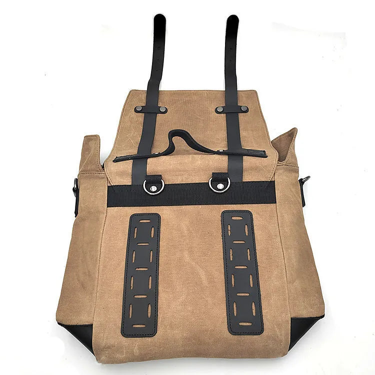 Black waterproof canvas motorcycle side pannier bag with leather trim mounted on a bike