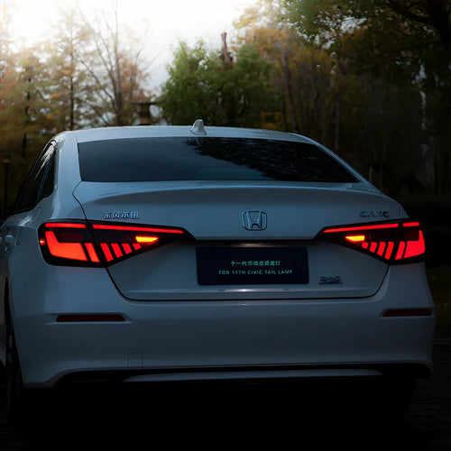 11th Generation Honda Civic black and red LED tail light assembly with sequential turn signal streamer.