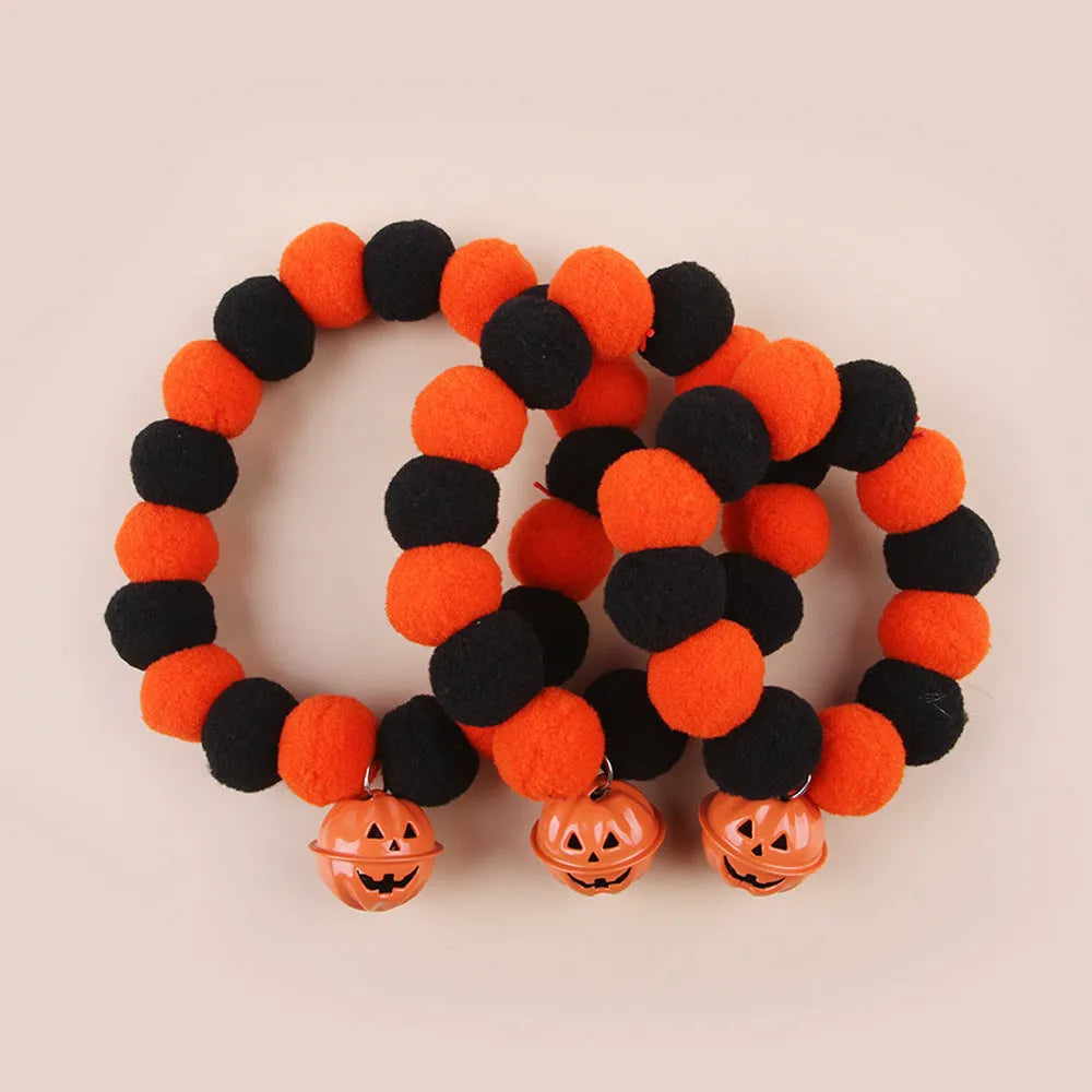 Orange Halloween cat collar with black pumpkin face design and a black adjustable buckle.