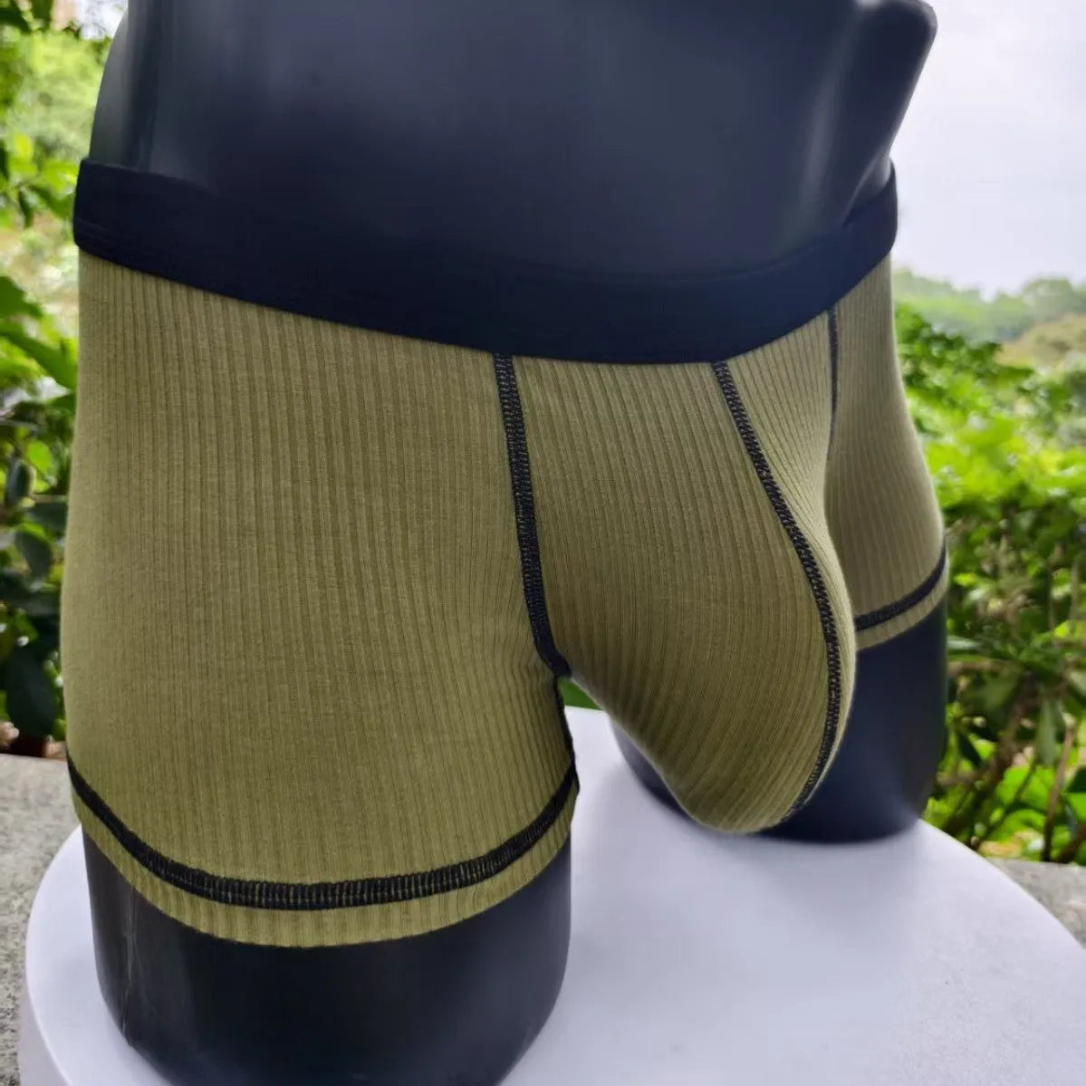 Men's solid colour breathable boxers in army green, shown flat.