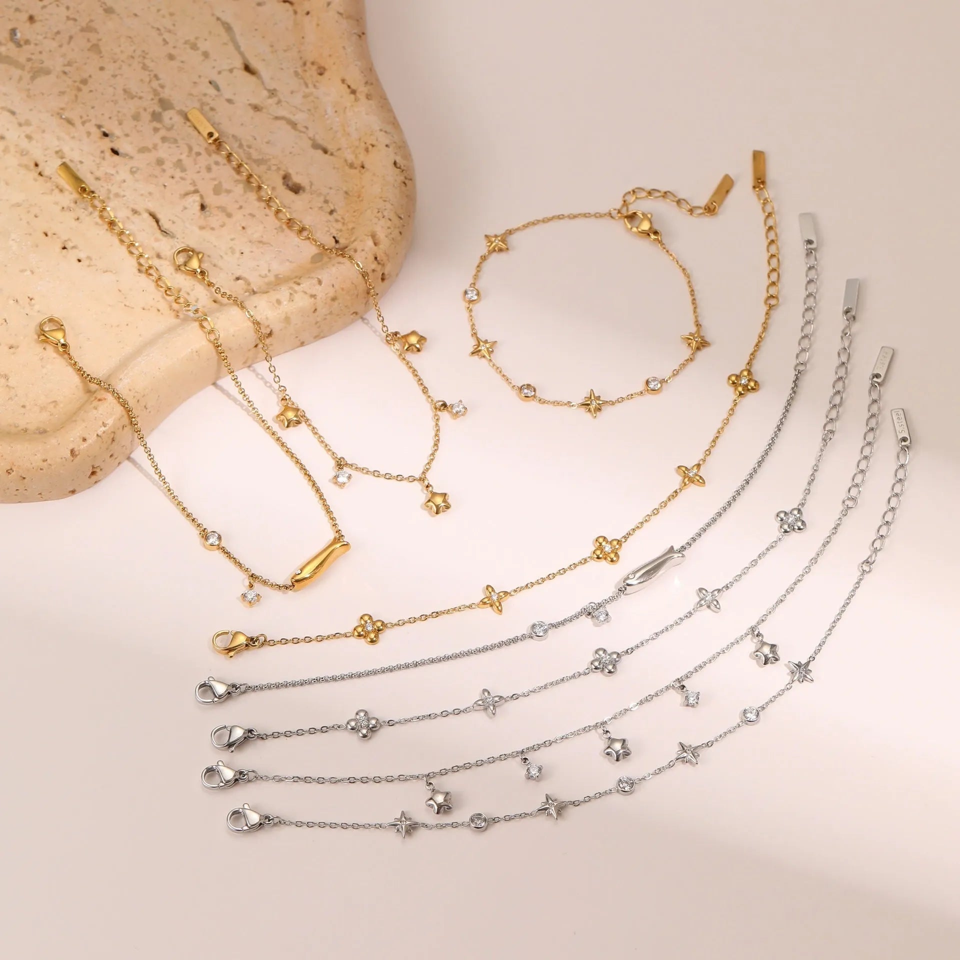 Women's titanium steel bracelet with gold-plated hexagonal star pendant set with zircon stone.