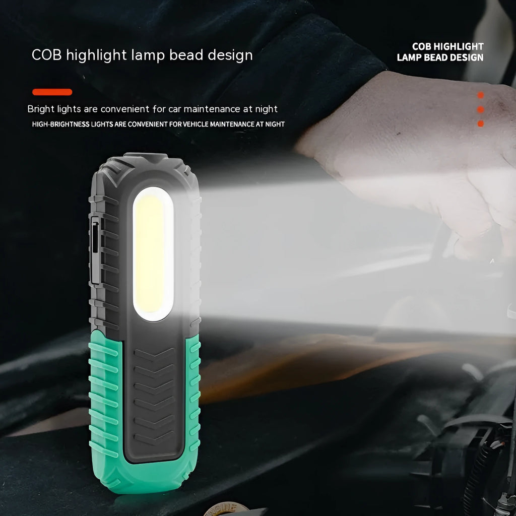 Black and green USB-charged automotive inspection work light with compact design