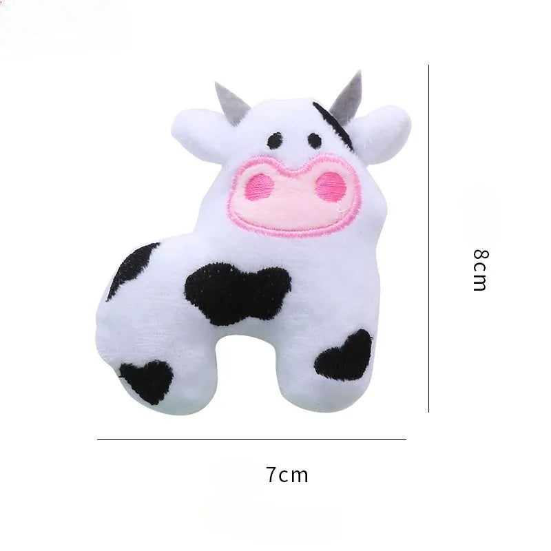 Plush cat toy in cow shape with catnip filling for interactive feline play