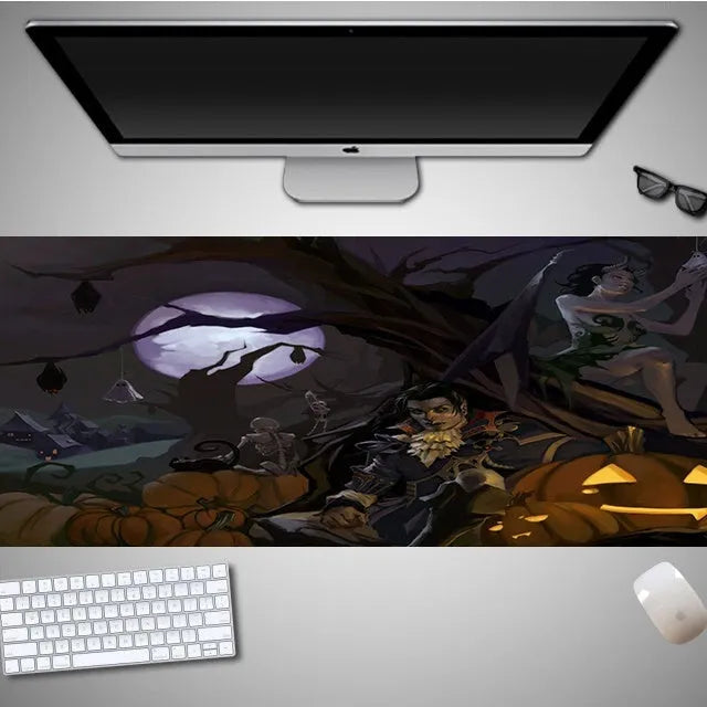 Oversized Halloween-themed computer mouse pad with non-slip rubber cloth base on a desk