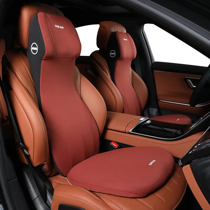 Integrated automotive memory foam seat cushion and headrest lumbar support pillow in various colours.