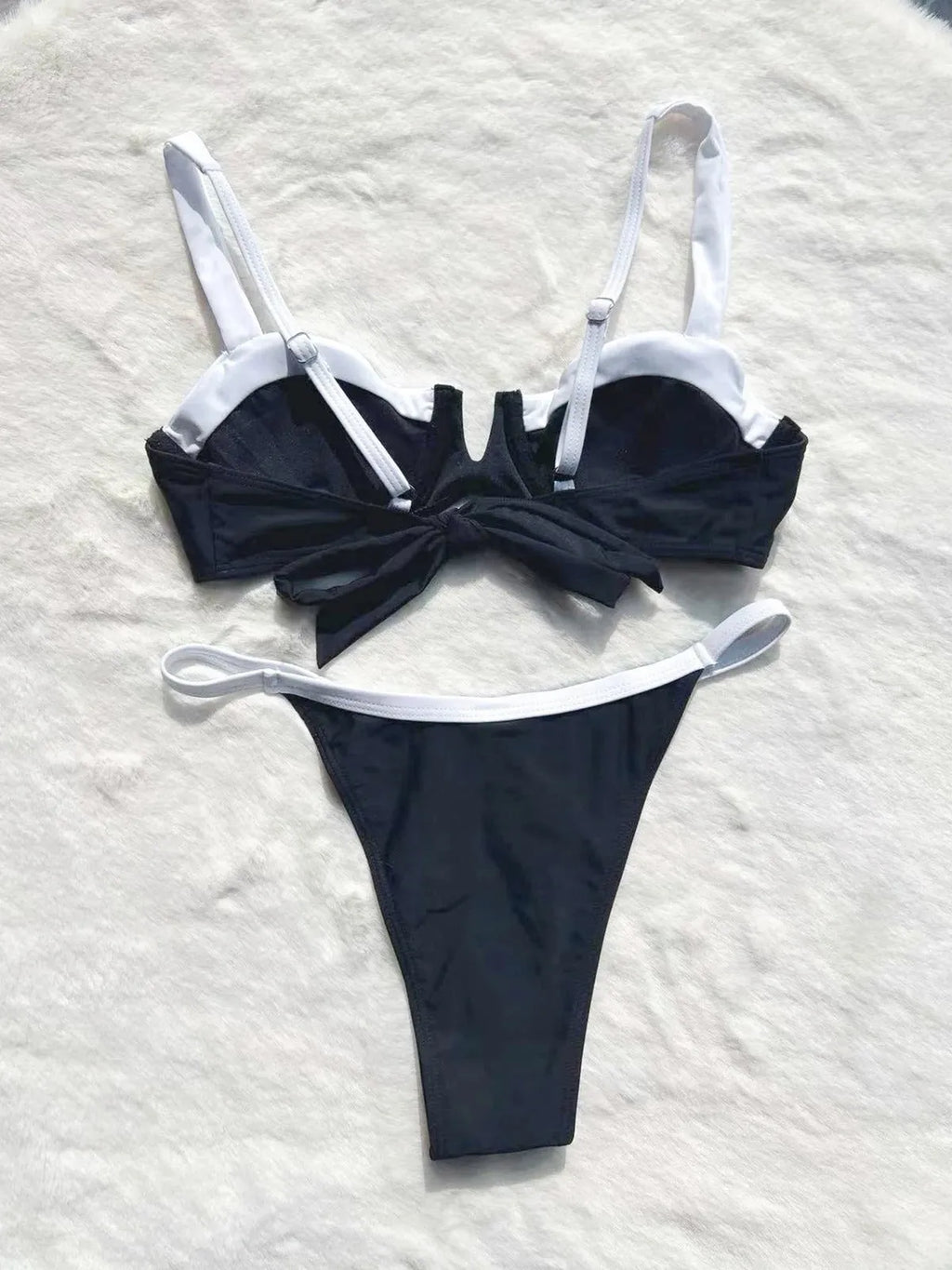 Black low waist women's bikini swimsuit with stitching split detail on briefs.