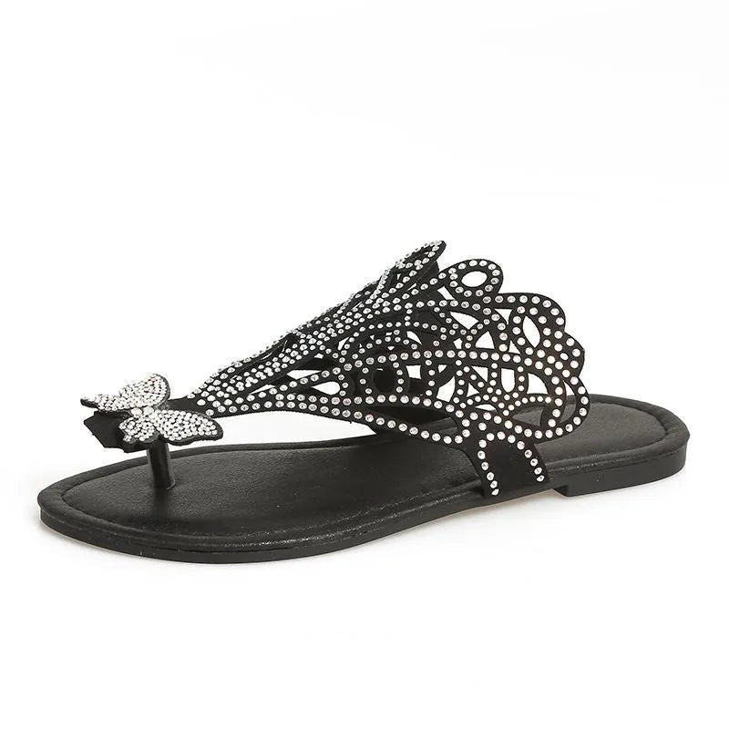 Women's black rhinestone flip-toe sandals with slip-on design and flat rubber sole