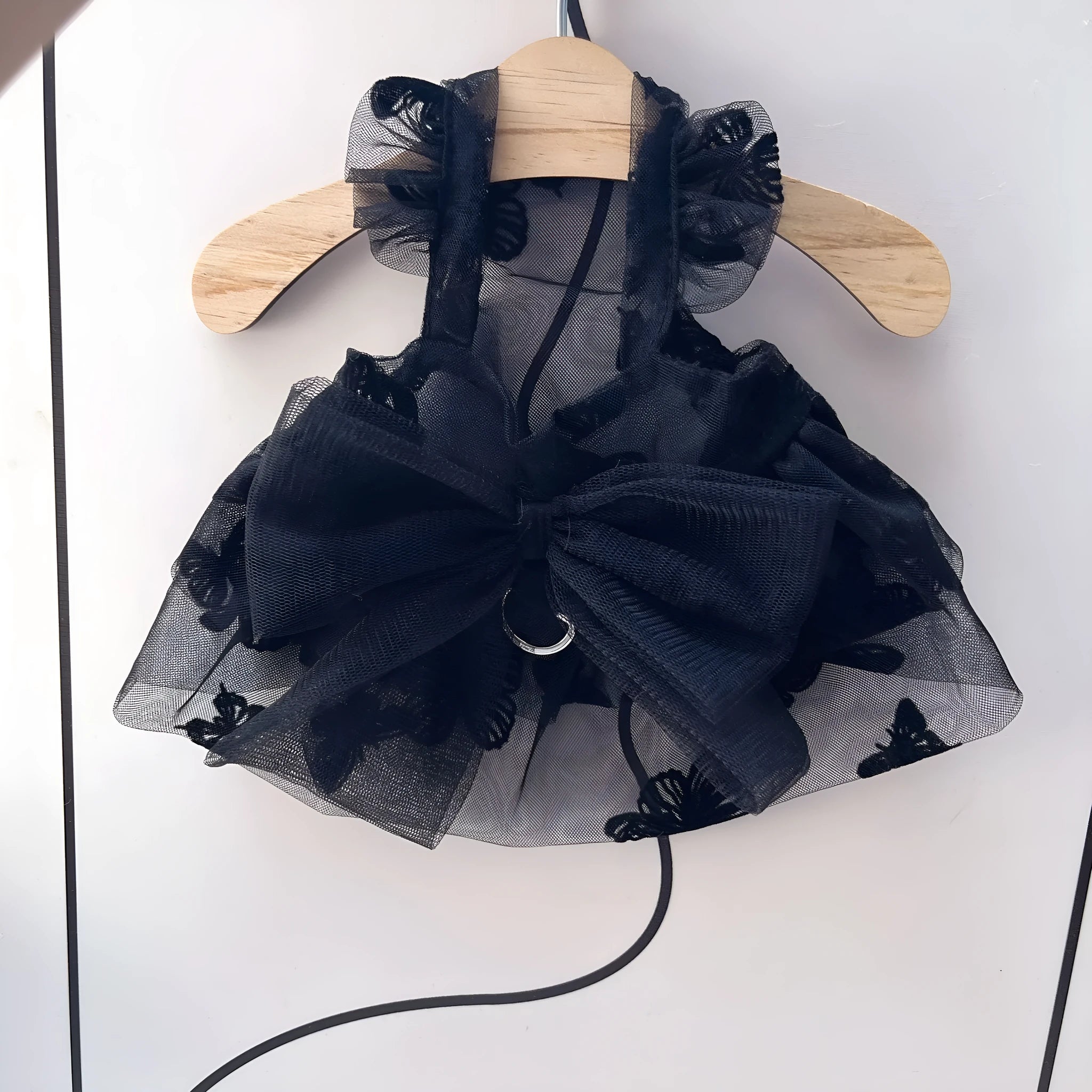 Black gauze princess tulle skirt for a small dog or cat, showing the pet clothing item.