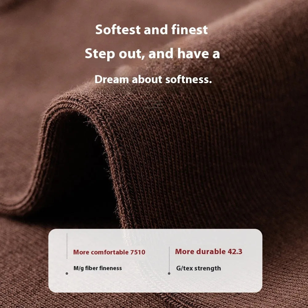 Mid-calf men's socks in solid colours made from combed cotton, shown in a stack.