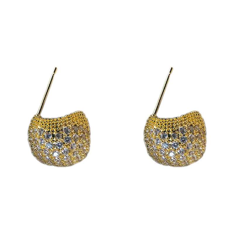 Gold geometric drop earrings with spherical elements and diamond detailing on clip-on backs