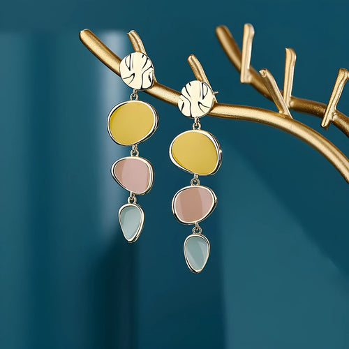 Morandi three-colour oil drip finish on disc-shaped alloy earrings with sterling silver posts.