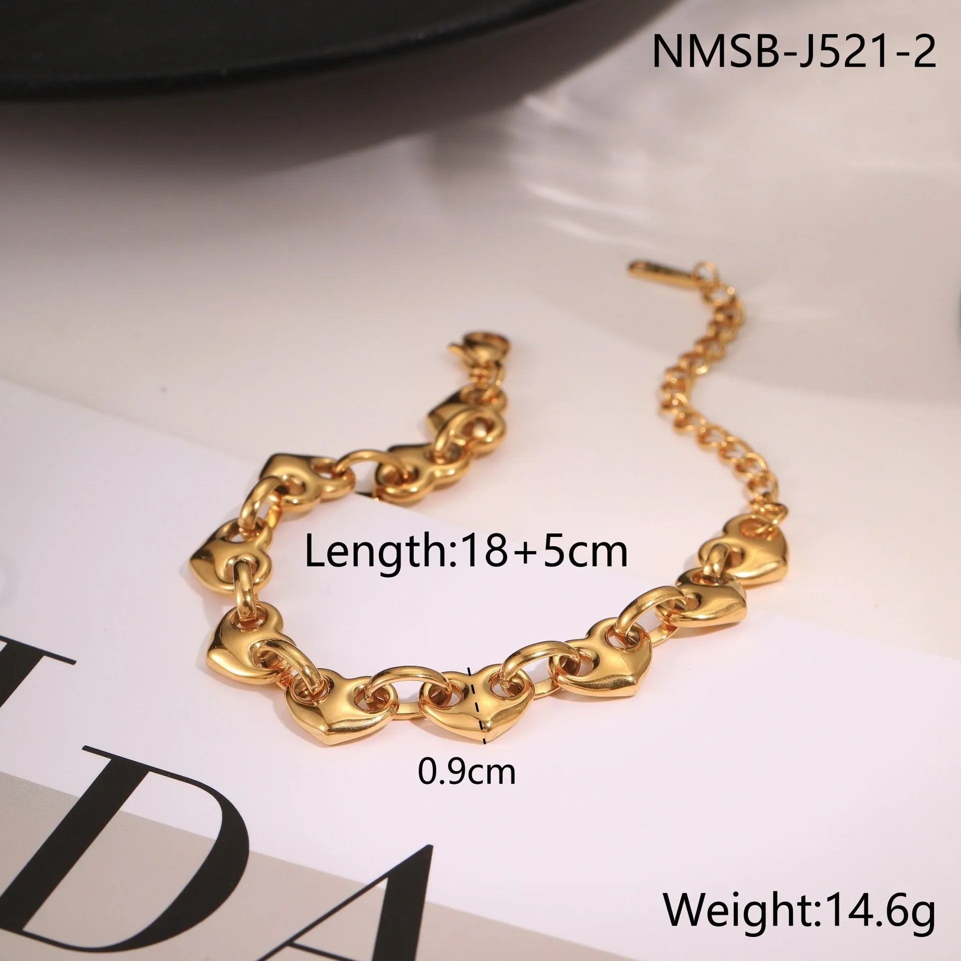 Women's hollowed-out heart bracelet in stainless steel with 18K gold plating on wrist