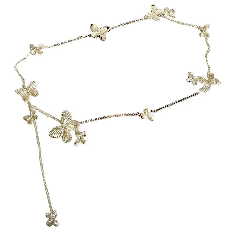 Gold and silver alloy waist chain with butterfly ornament, showing 104cm length.