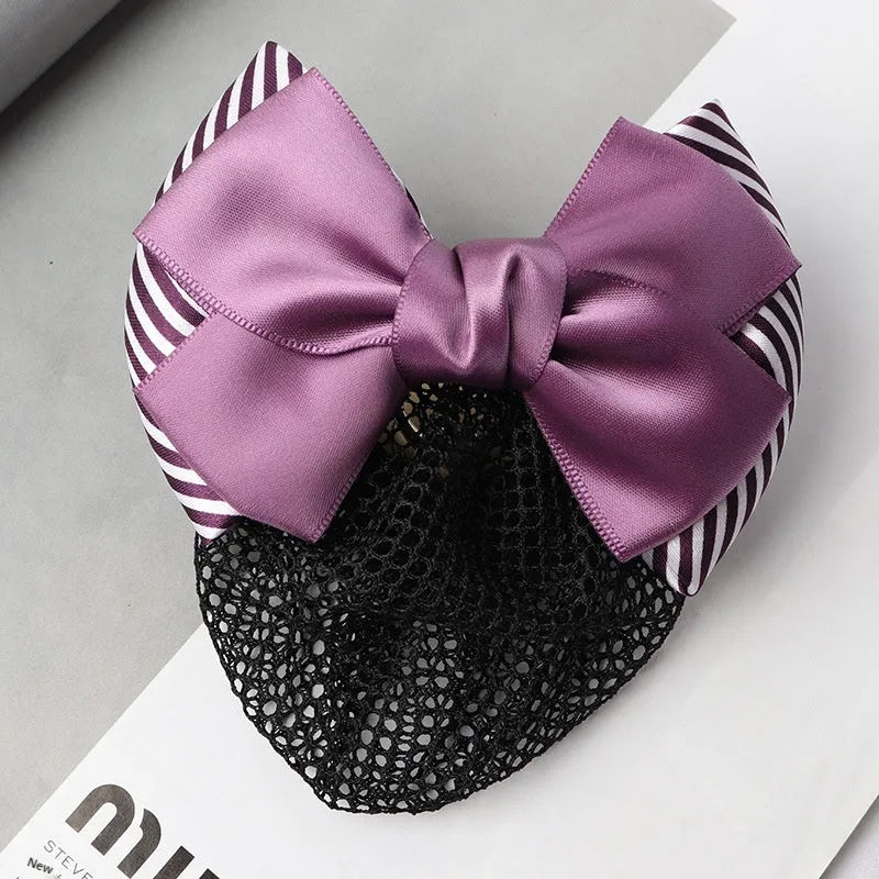 Professional flower bow headdress hair clip ornament on a work plate, shown in a selection of net and mesh colour variations.