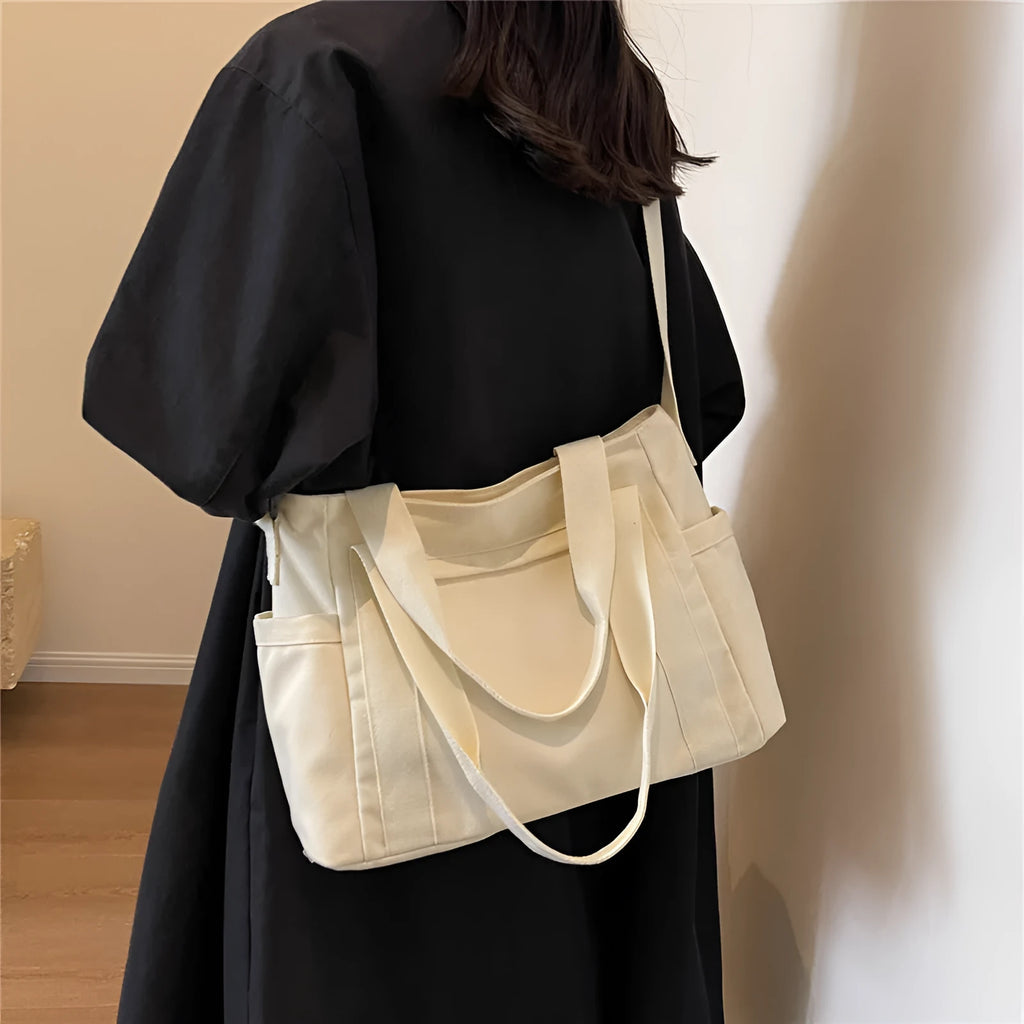 Women's canvas-style polyester shoulder bag with sandwich pocket and phone compartment in solid colour