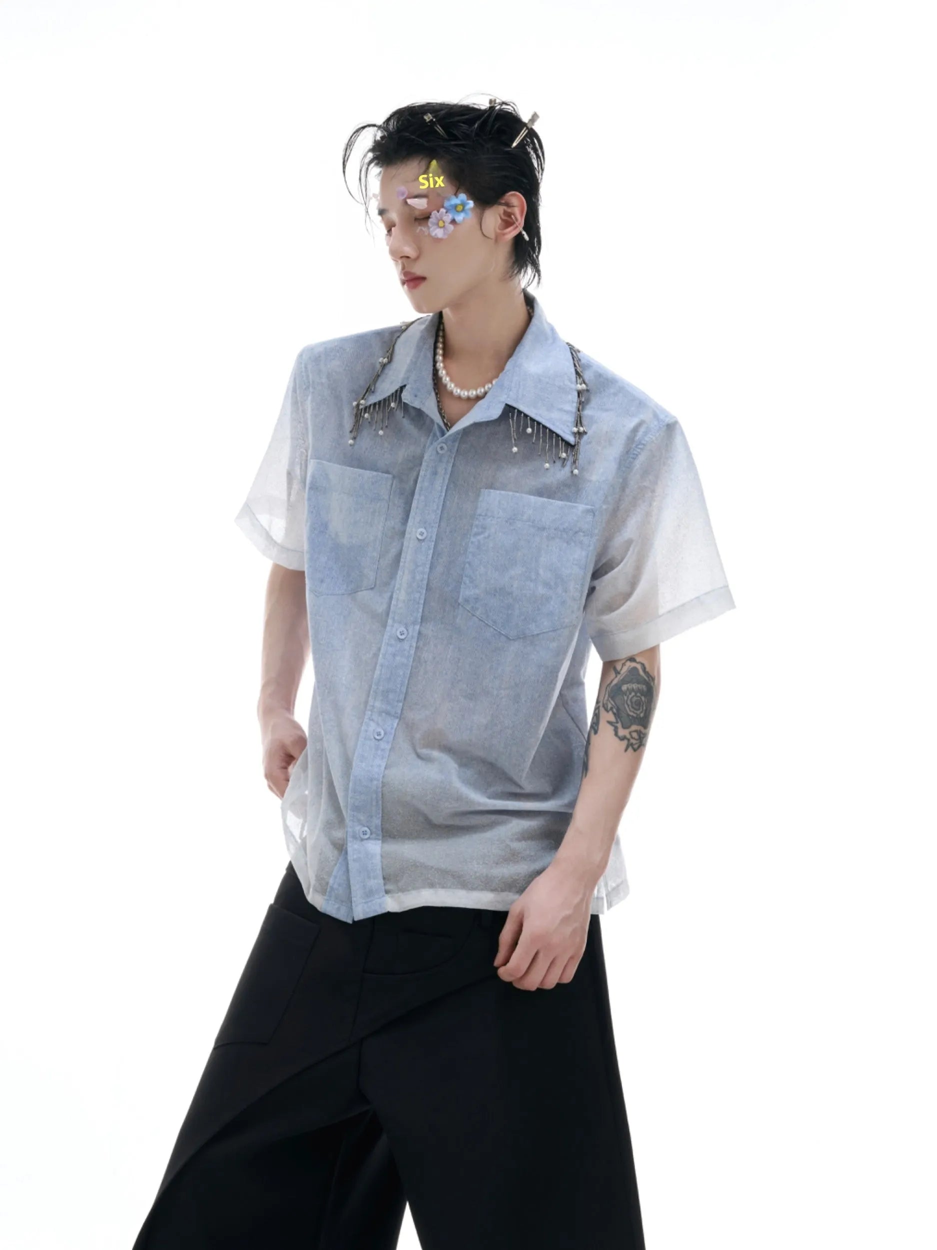 Men's solid blue loose fit short sleeve casual shirt on a hanger.