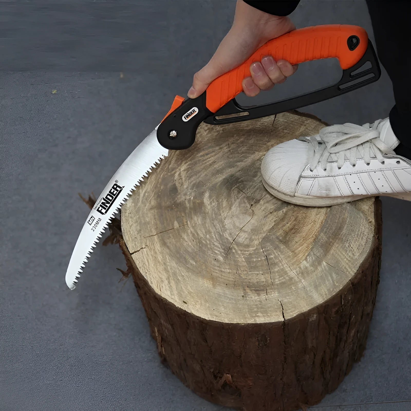 Folding garden saw with TPR grip and 230mm steel blade extended for cutting
