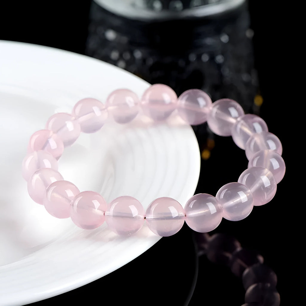 Women's natural starlight crystal bracelet with round pink beads in various size options