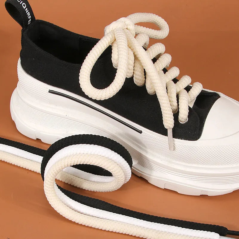 Pair of round woven shoelaces in white next to a ruler showing 10mm diameter and length scale.