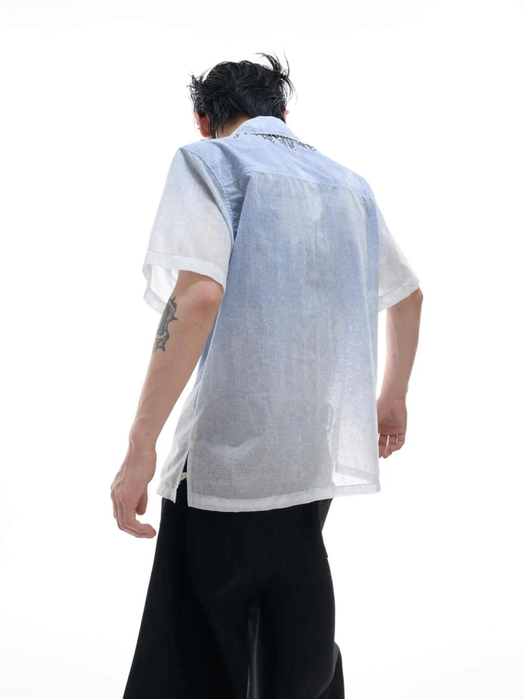 Men's solid blue loose fit short sleeve casual shirt on a hanger.