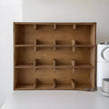 Square birch wood cup storage rack with multiple grid compartments