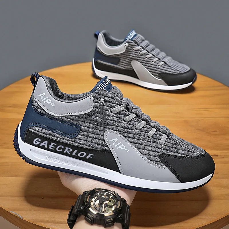 Men's lightweight mesh running shoe in green or grey with lace-up front and round toe