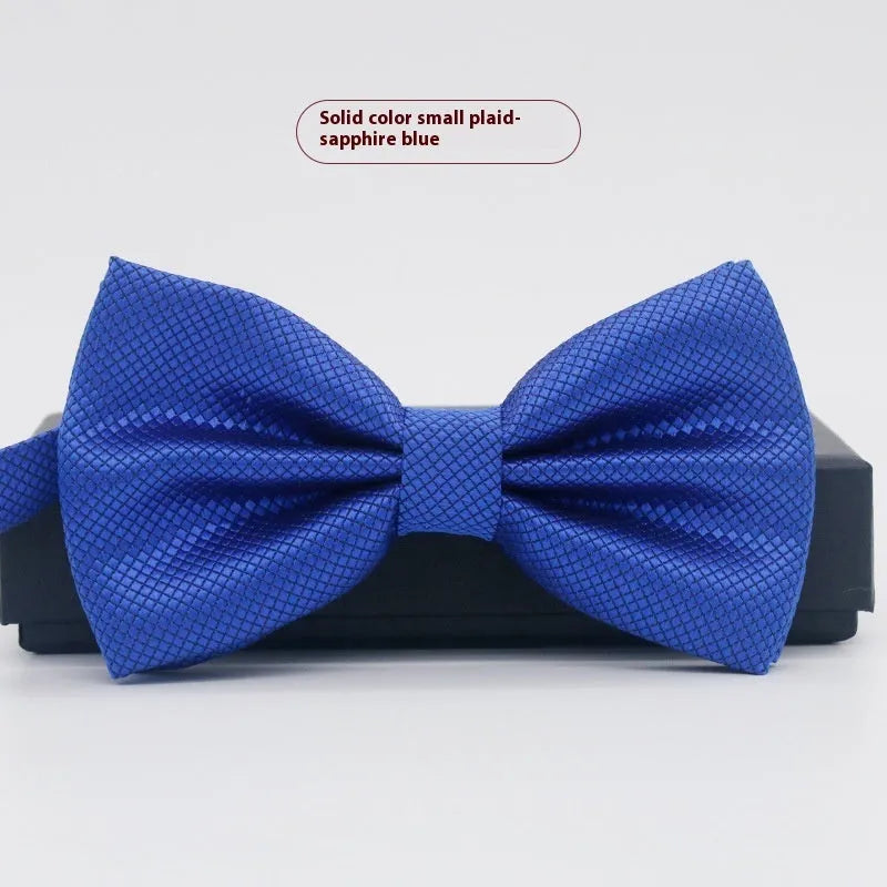 Men's flat head solid colour bow tie in polyester, showing 12cm by 6cm size on a background.
