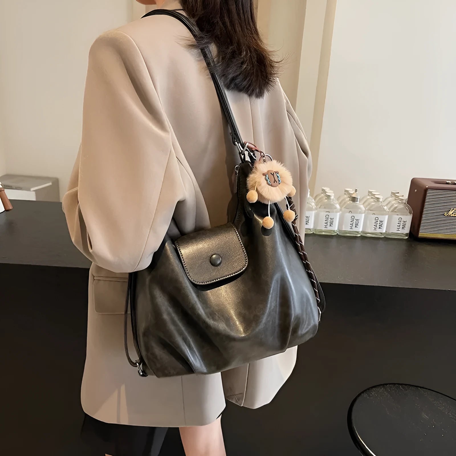 Women's black PU leather horizontal square shoulder bag with single strap and internal phone pocket