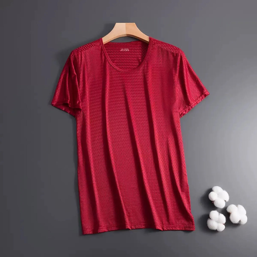 Man wearing a loose-fit ice silk short sleeve T-shirt in a solid colour.
